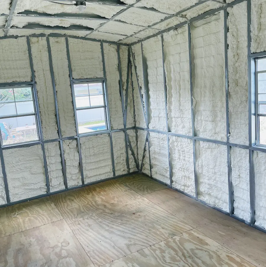 Closed-cell spray foam insulation applied to wall cavities in a residential project in Opelika